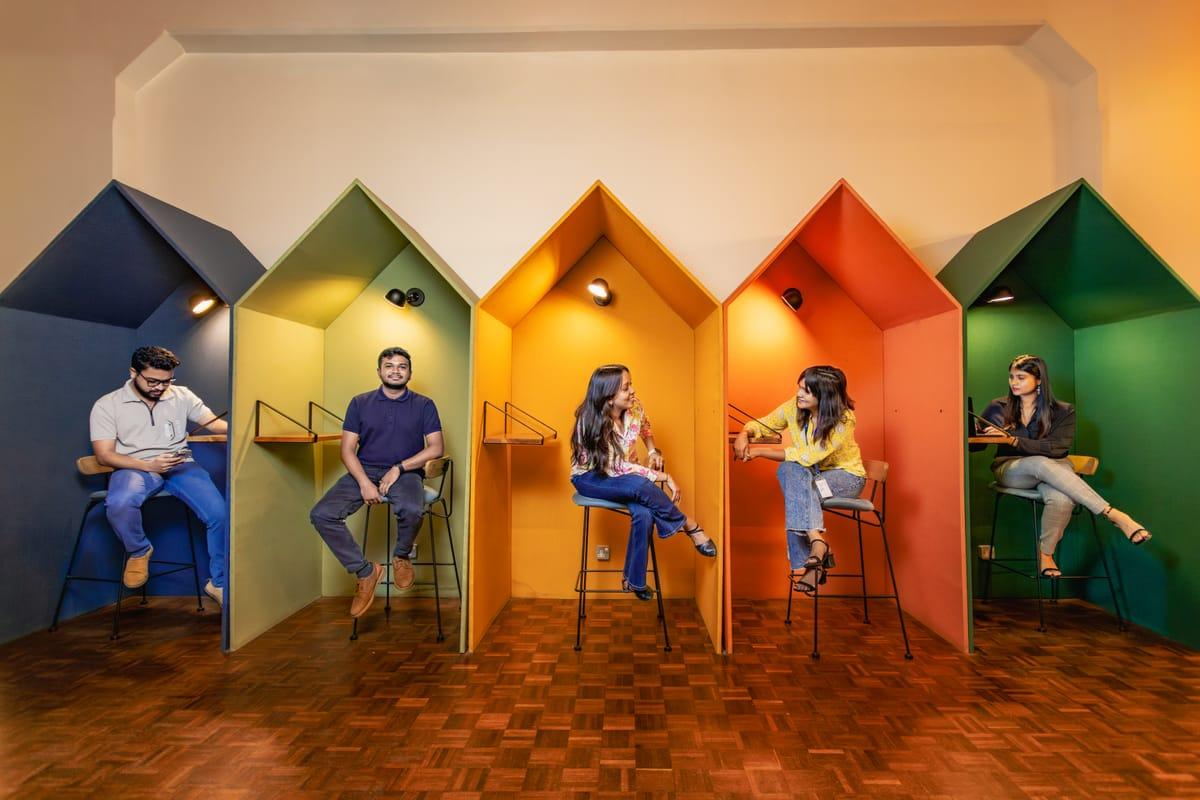 Colleagues sitting in the colourful focus pods at Hatch, Colombo