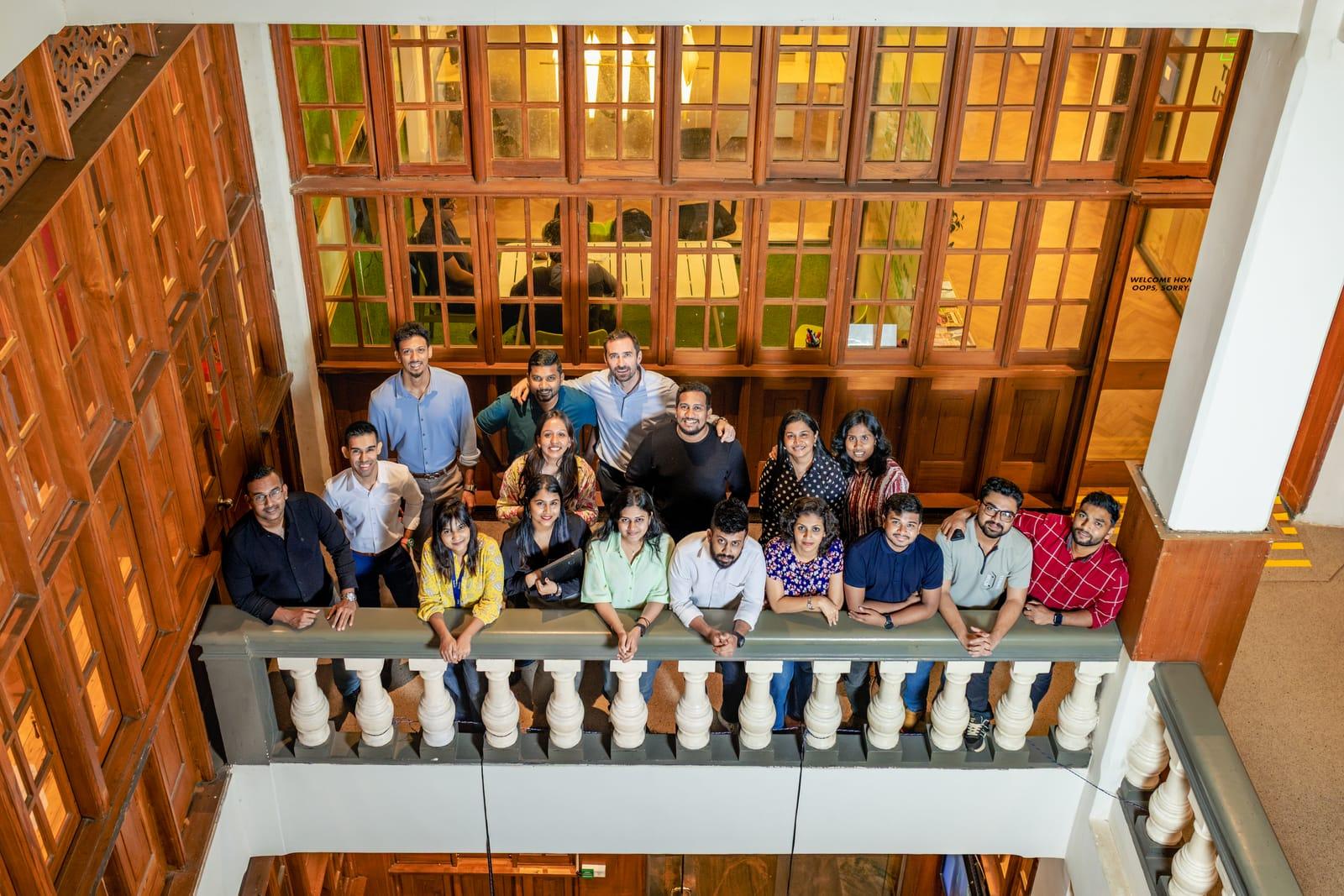 The Raketman team on a balcony overlooking the atrium at Hatch, Colombo